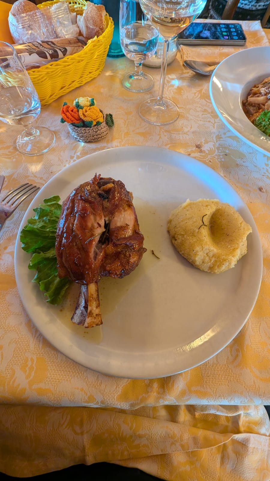 polenta and pork shank trattoria da martino, a traditional restaurant in bergamo province